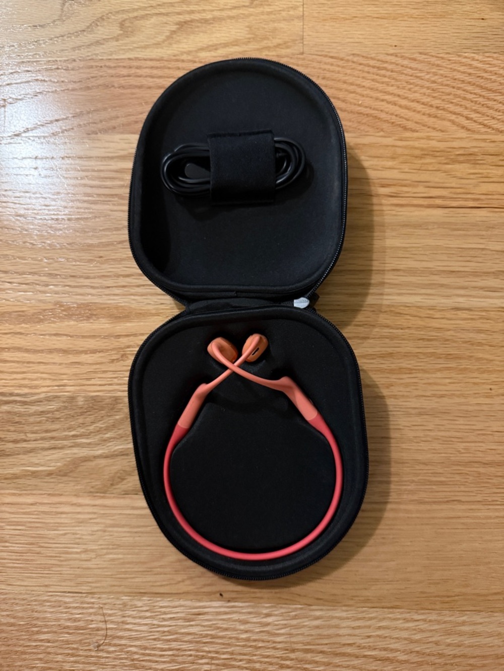 Shokz Open Run Pro Bone Conducting Headphones in Coral and Orange